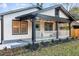 Charming home featuring a covered porch with string lights and a welcoming front door at 503 Mcwilliams Se Rd, Atlanta, GA 30315