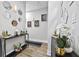 Stylish hallway featuring decorative mirrors, artwork, and modern console tables at 503 Mcwilliams Se Rd, Atlanta, GA 30315