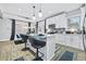 Bright kitchen with white cabinetry, stainless steel appliances, and island seating at 503 Mcwilliams Se Rd, Atlanta, GA 30315