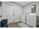 Bright laundry room includes washer, dryer, and storage, offering convenience and functionality at 503 Mcwilliams Se Rd, Atlanta, GA 30315