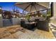 Cozy patio with a fire pit, umbrella, and comfortable seating, perfect for outdoor gatherings at 503 Mcwilliams Se Rd, Atlanta, GA 30315