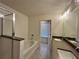 Bathroom featuring soaking tub, glass shower, and double vanity at 1910 Victoria Way # 120, Conyers, GA 30013