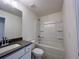 A clean and bright bathroom featuring a combination tub and shower at 1910 Victoria Way # 120, Conyers, GA 30013
