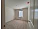 Carpeted bedroom with a window, offering a bright and comfortable space at 1910 Victoria Way # 120, Conyers, GA 30013