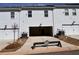 Townhome with open garage and landscaping at 1910 Victoria Way # 120, Conyers, GA 30013