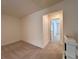 Hallway with carpeted floors and white walls, offering a neutral and versatile space at 1910 Victoria Way # 120, Conyers, GA 30013