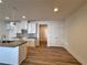 Open kitchen with white cabinets, dark countertops, and stainless steel sink at 1910 Victoria Way # 120, Conyers, GA 30013