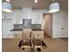 Modern kitchen with a gray island and a view to a large closet at 1910 Victoria Way # 120, Conyers, GA 30013