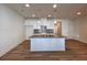 Modern kitchen with a gray island and white cabinetry at 1910 Victoria Way # 120, Conyers, GA 30013