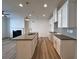 A kitchen features white cabinets, a center island, and stainless steel appliances at 1910 Victoria Way # 120, Conyers, GA 30013