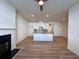 Open floor plan with a kitchen with a large island and a fireplace at 1910 Victoria Way # 120, Conyers, GA 30013
