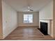 Bright living room with a fireplace, ceiling fan, and wood-look flooring at 1910 Victoria Way # 120, Conyers, GA 30013