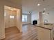 Bright living room featuring a fireplace, ceiling fan, and wood-look flooring at 1910 Victoria Way # 120, Conyers, GA 30013