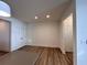 Open living space with vinyl plank flooring, featuring natural light and potential for customization at 1910 Victoria Way # 120, Conyers, GA 30013