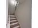 Bright staircase with wood treads and white risers, offering a clean and modern design at 1910 Victoria Way # 120, Conyers, GA 30013