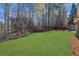 The expansive backyard features a lush lawn, complemented by a patio at 3485 Walnut Rdg, Atlanta, GA 30349