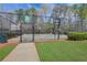 Community basketball court is fenced and provides a space for recreational games and exercise at 3485 Walnut Rdg, Atlanta, GA 30349