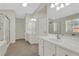 Bright bathroom featuring double sinks, walk-in shower, and soaking tub at 3485 Walnut Rdg, Atlanta, GA 30349