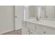 Bright bathroom vanity featuring white countertops and ample cabinet space at 3485 Walnut Rdg, Atlanta, GA 30349