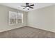 Bedroom showcasing a ceiling fan and natural light from the large window at 3485 Walnut Rdg, Atlanta, GA 30349