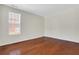 A clean bedroom featuring wood floors and natural light at 3485 Walnut Rdg, Atlanta, GA 30349