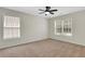 Bedroom with natural light, neutral carpet, and ceiling fan at 3485 Walnut Rdg, Atlanta, GA 30349
