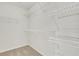 Walk-in closet with ample shelving for optimal storage at 3485 Walnut Rdg, Atlanta, GA 30349