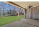 Covered patio with ceiling fan overlooks the spacious backyard at 3485 Walnut Rdg, Atlanta, GA 30349