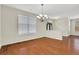 Bright dining room with hardwood floors, a chandelier, and a view of the entryway at 3485 Walnut Rdg, Atlanta, GA 30349