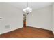 Cozy dining room with hardwood floors, a chandelier, and a view into the kitchen at 3485 Walnut Rdg, Atlanta, GA 30349