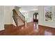 Inviting entryway featuring hardwood floors, staircase, and decorative windowed front door at 3485 Walnut Rdg, Atlanta, GA 30349