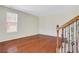 Bright entryway featuring gleaming hardwood floors and a staircase with wrought iron detailing at 3485 Walnut Rdg, Atlanta, GA 30349
