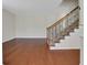 Inviting entryway featuring hardwood floors and a staircase with decorative iron railings at 3485 Walnut Rdg, Atlanta, GA 30349