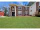 Charming two-story brick home with a well-manicured lawn at 3485 Walnut Rdg, Atlanta, GA 30349