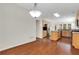 Open kitchen and dining area with hardwood floors and stainless steel appliances at 3485 Walnut Rdg, Atlanta, GA 30349