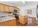 Modern kitchen with granite countertops, stainless steel appliances, and a center island at 3485 Walnut Rdg, Atlanta, GA 30349