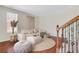 Inviting living room with hardwood floors, neutral furniture and stairs with iron banisters at 3485 Walnut Rdg, Atlanta, GA 30349