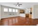 Bright living room with hardwood floors and a kitchen and dining area in the background at 3485 Walnut Rdg, Atlanta, GA 30349