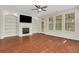 Bright living room with hardwood floors, a cozy fireplace, and lots of natural light at 3485 Walnut Rdg, Atlanta, GA 30349