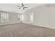 Large primary bedroom featuring high ceilings, large windows and neutral carpet at 3485 Walnut Rdg, Atlanta, GA 30349