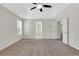 Carpeted main bedroom with tray ceilings and natural light at 3485 Walnut Rdg, Atlanta, GA 30349