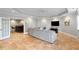Finished basement with an entertainment area, featuring tile floors, doors leading to a bar and neutral tones at 12680 Old Surrey Pl, Roswell, GA 30075