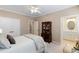 Light-filled bedroom with carpet, access to the bathroom, and a view of another bedroom at 12680 Old Surrey Pl, Roswell, GA 30075