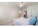 Bright bedroom showcases a bed, views of the bathroom, and a light-colored interior at 12680 Old Surrey Pl, Roswell, GA 30075