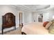Serene bedroom featuring a queen-sized bed, soft lighting and open doorway at 12680 Old Surrey Pl, Roswell, GA 30075