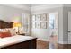 Bedroom featuring a window with plantation shutters and an ensuite bath at 12680 Old Surrey Pl, Roswell, GA 30075