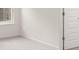 Bright bedroom features plush carpeting, a large window, and neutral paint at 13567 Tolstoy Drive, Covington, GA 30014