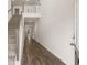 Bright foyer with wood floors, staircase, and an open view to the second floor balcony at 13567 Tolstoy Drive, Covington, GA 30014