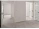 Hallway with carpet and several doorways at 13567 Tolstoy Drive, Covington, GA 30014