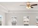 Spacious main bedroom has plush carpet, lots of natural light, and a ceiling fan at 13567 Tolstoy Drive, Covington, GA 30014